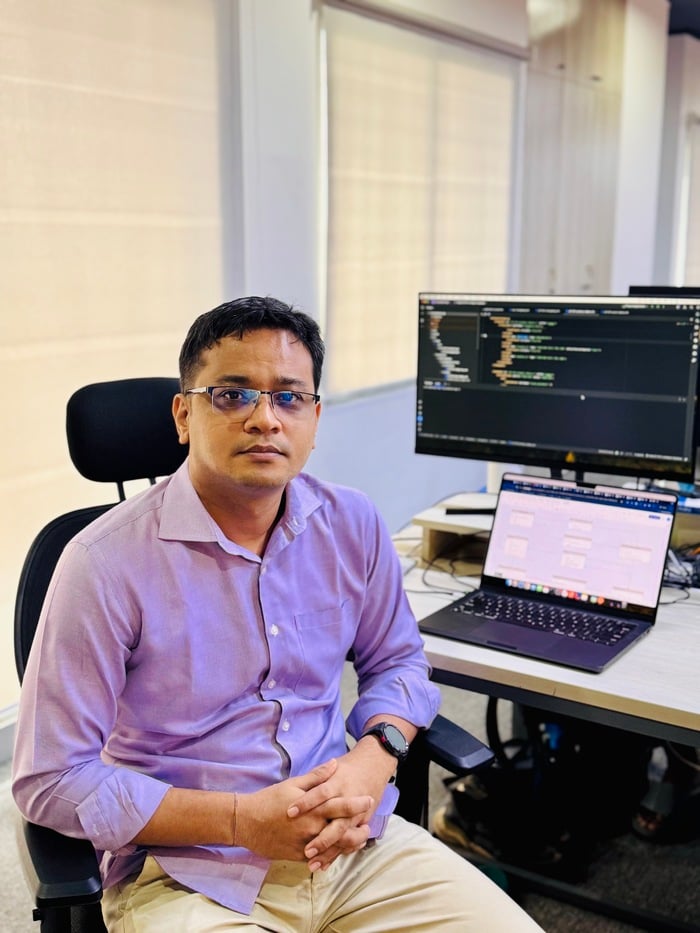 Sumoy Barua in front of his computer at his workplace at Cefalo